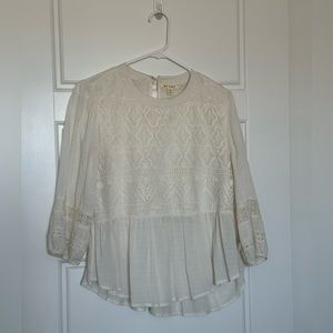 Cream embroidered peplum top with lace detail. Size M.